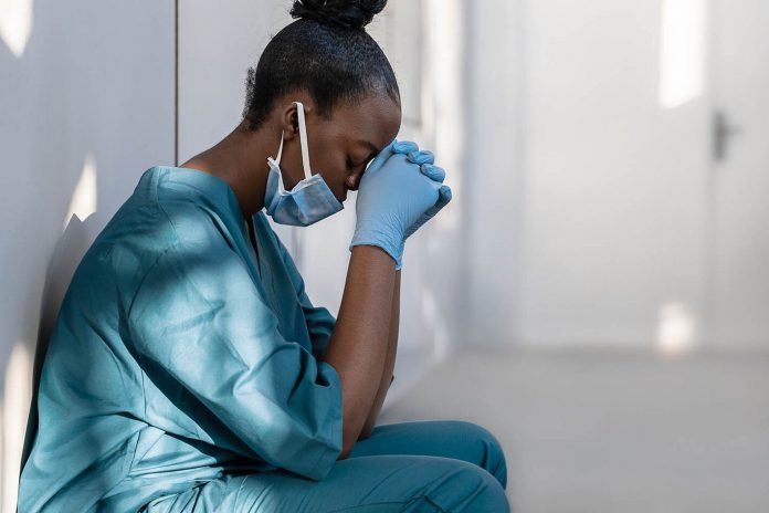 ecc-exhausted-health-care-worker